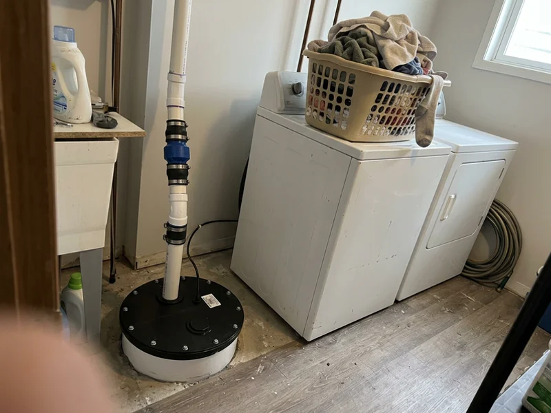 Finished replacement with a sealed lid and new check valve in a laundry room
